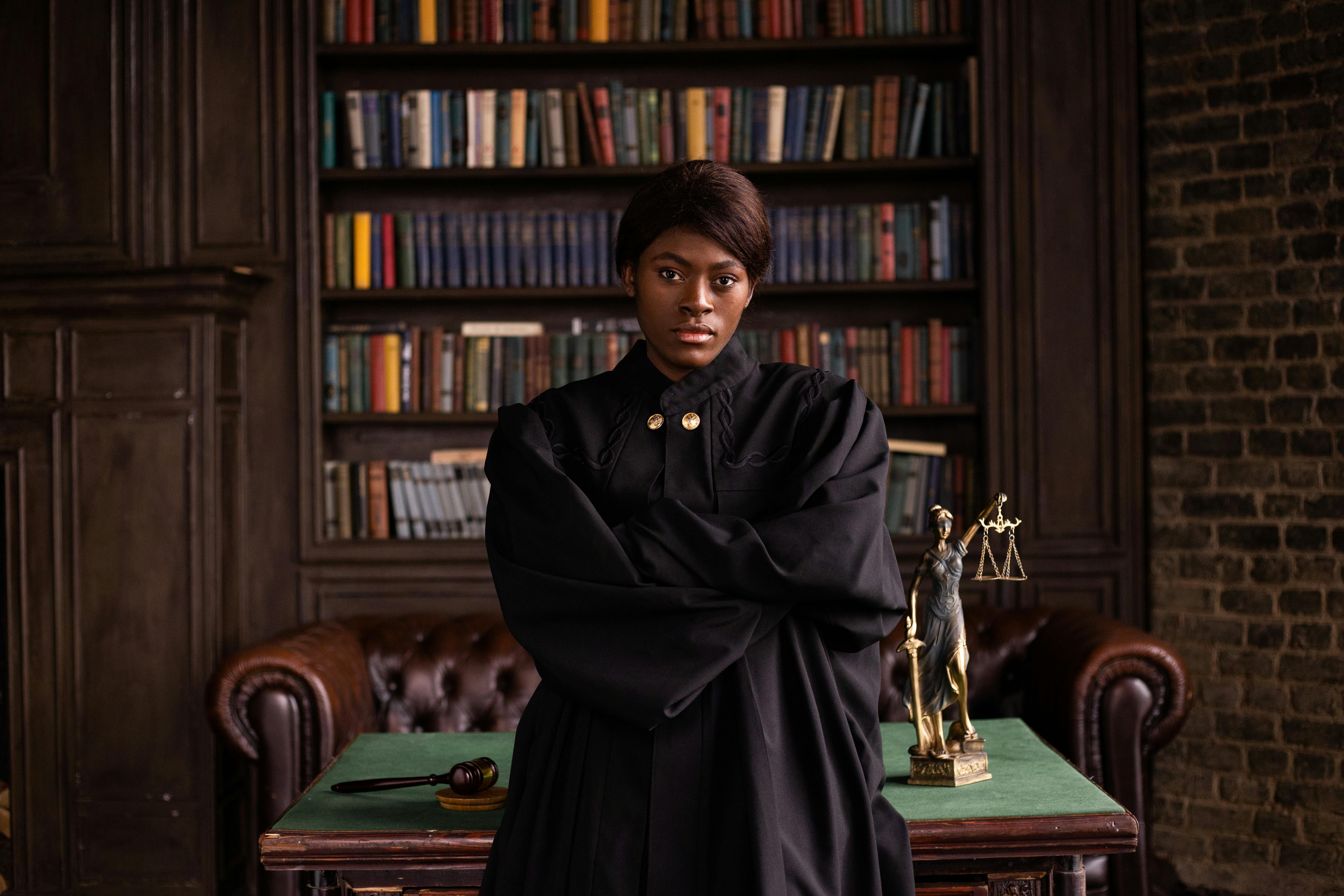 African Amercian woman judge in office in front of bookcase